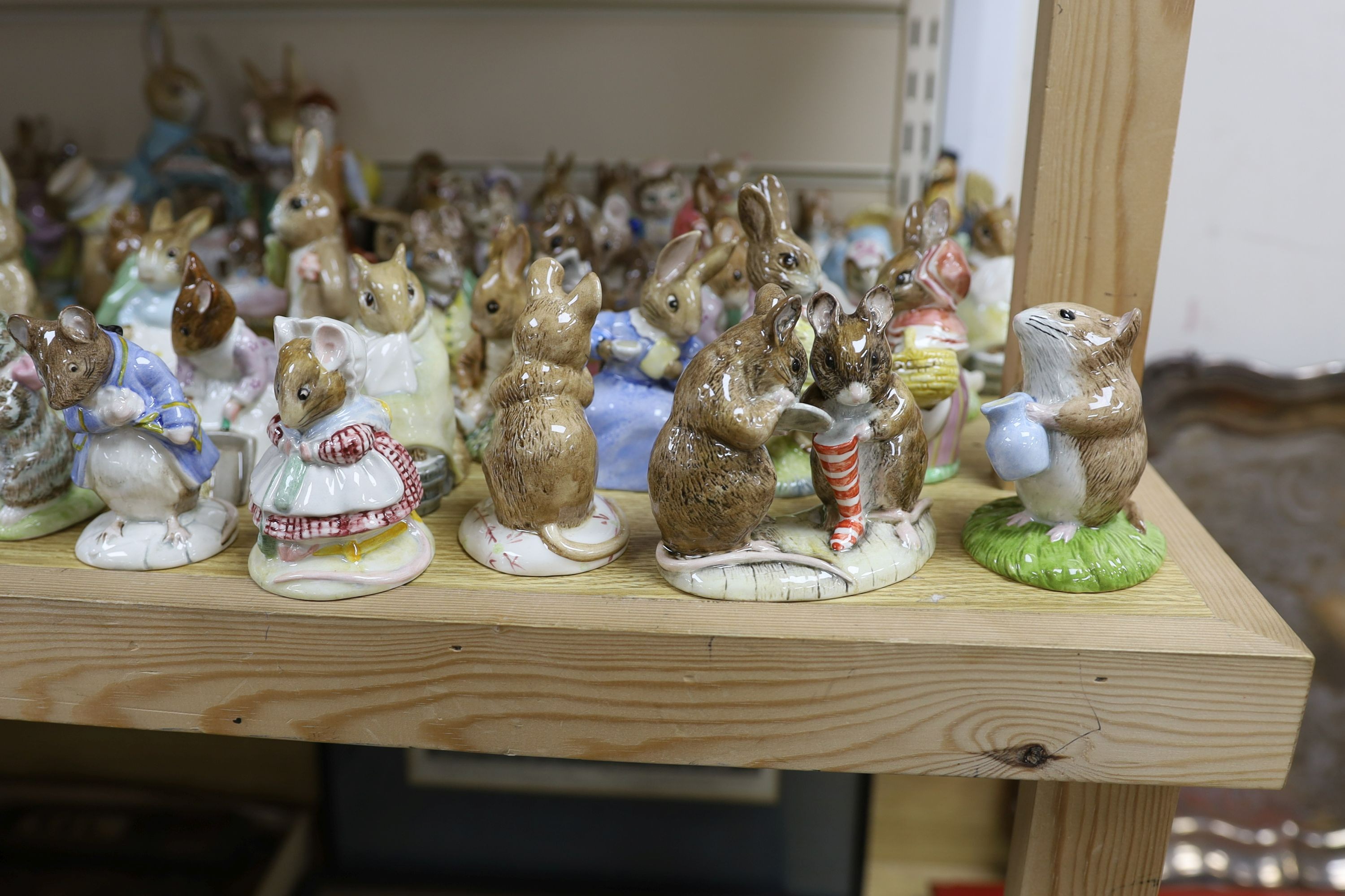 A large collection of Beatrix Potter ceramic figures by Royal Doulton, Beswick and Royal Albert, to include ‘Sir Isaac Newton’ and ‘Mr McGregor’